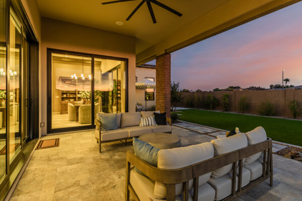 Hazelwood Model Back Patio with dusk light and views into dining room